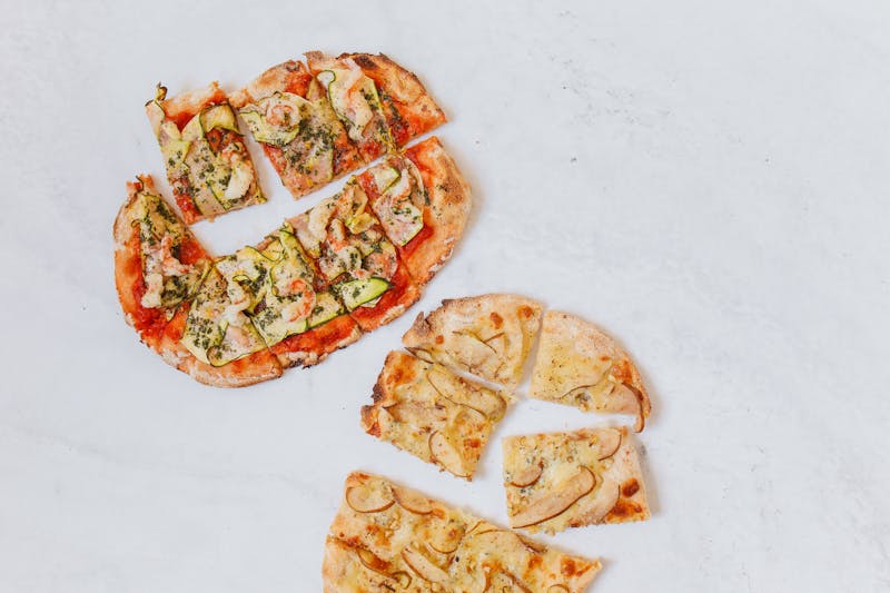 Green lantern pizza being prepared for delivery - fresh ingredients