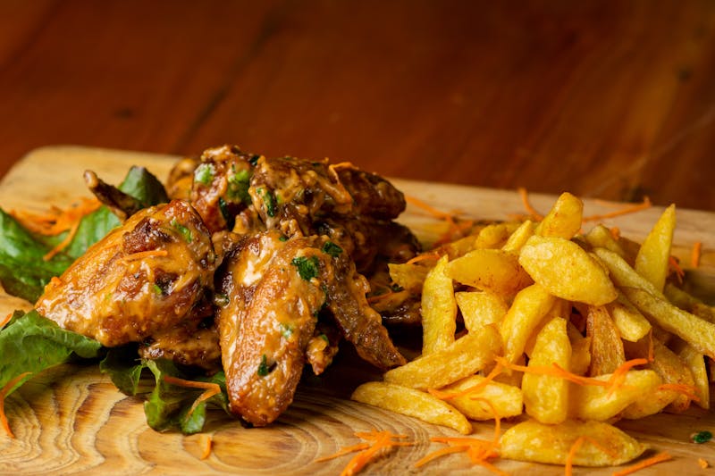 Buffalo wings with celery and blue cheese dipping sauce