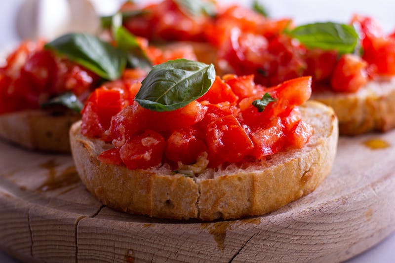 Bruschetta with tomatoes, basil and olive oil on toasted bread