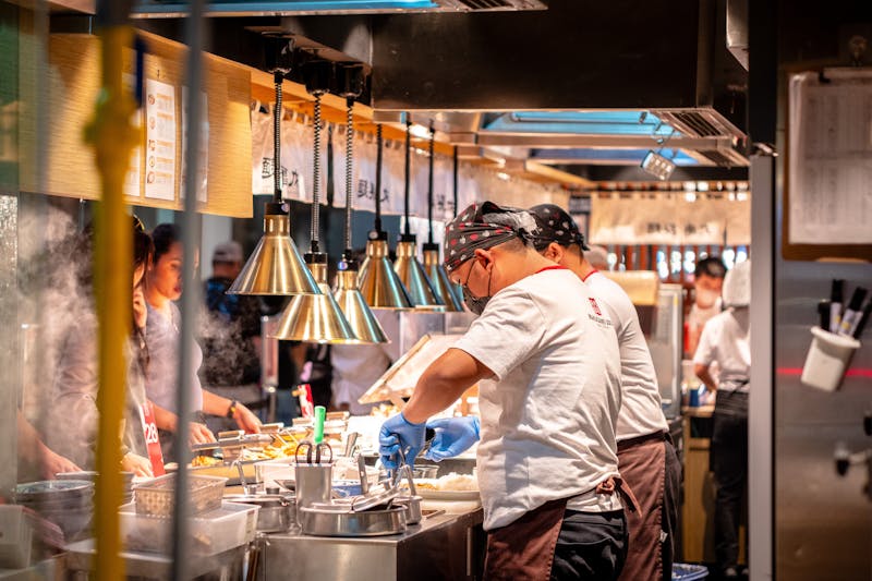 Green lantern pizza team preparing fresh ingredients